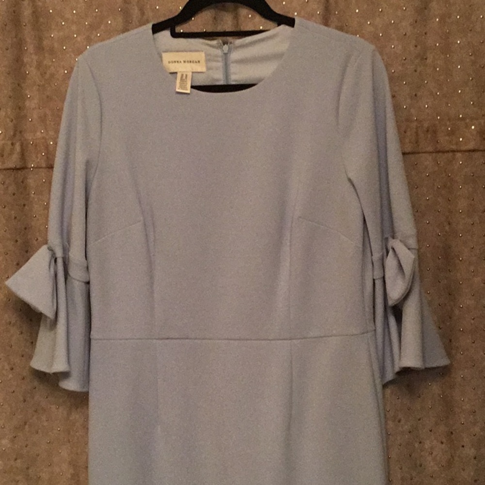 Light blue dress with bows on the sleeves